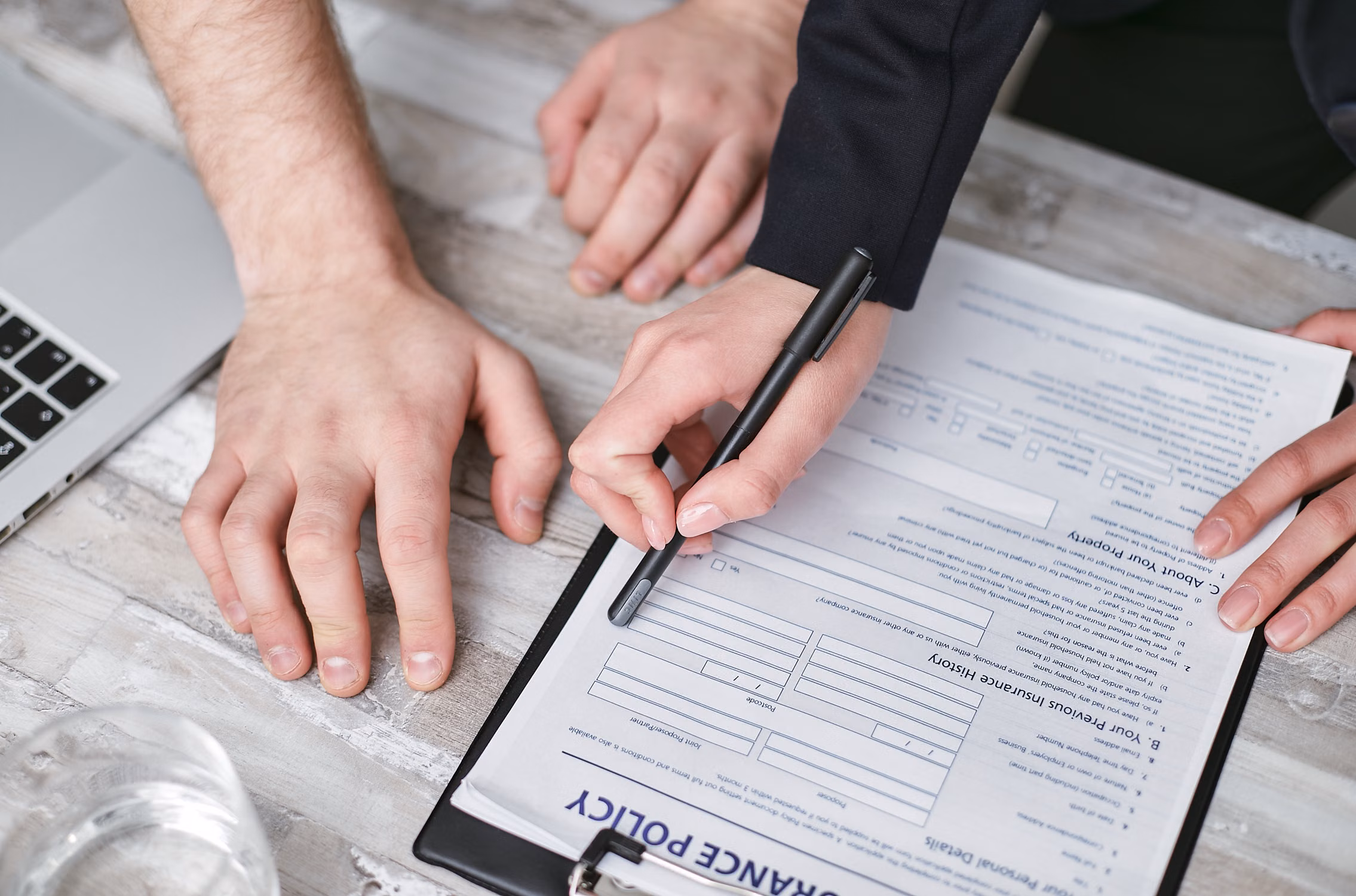 Underwriter reviewing due diligence reports before issuing indemnity insurance