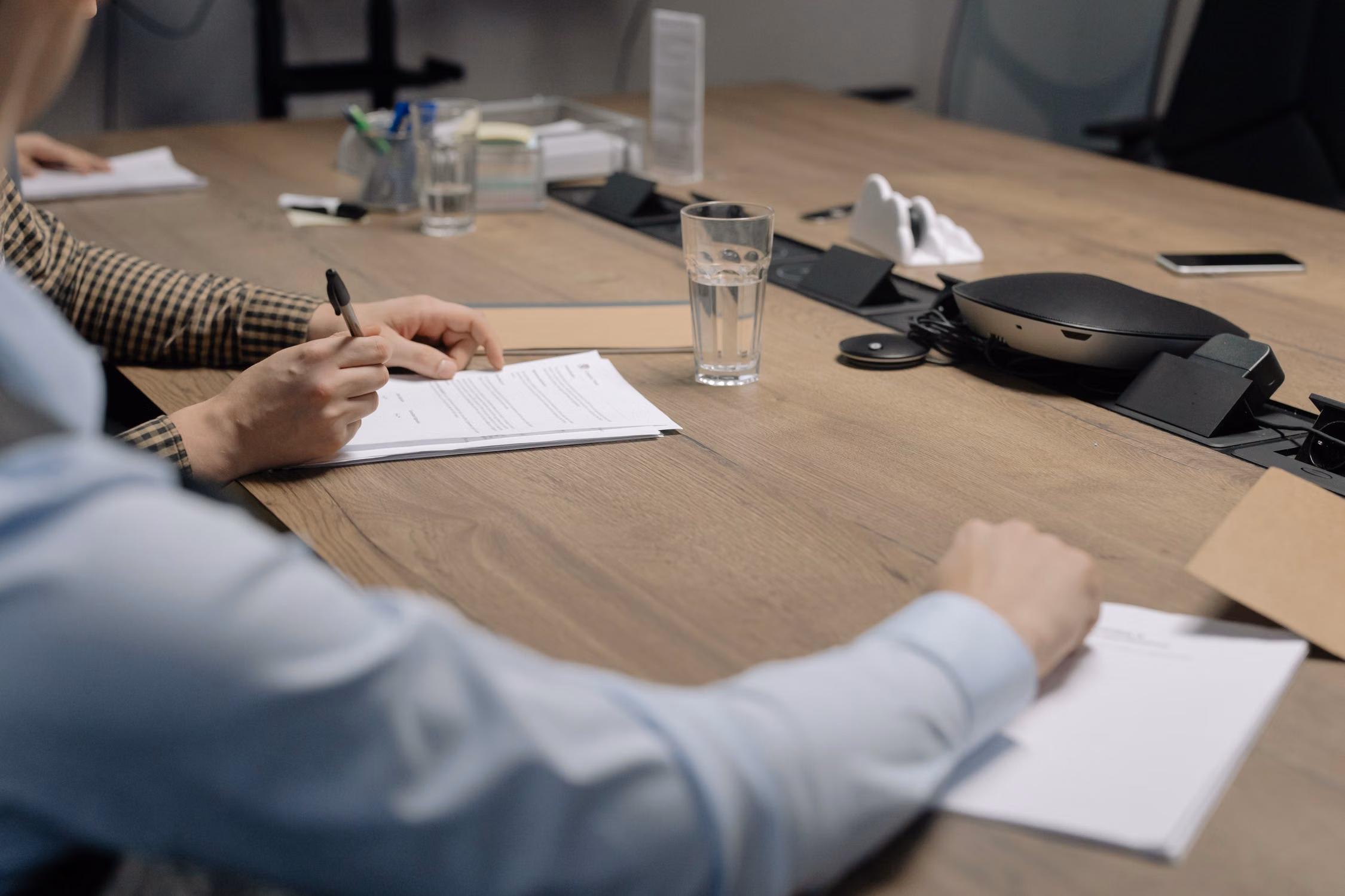 Signing a M&A purchase agreement at an M&A closing