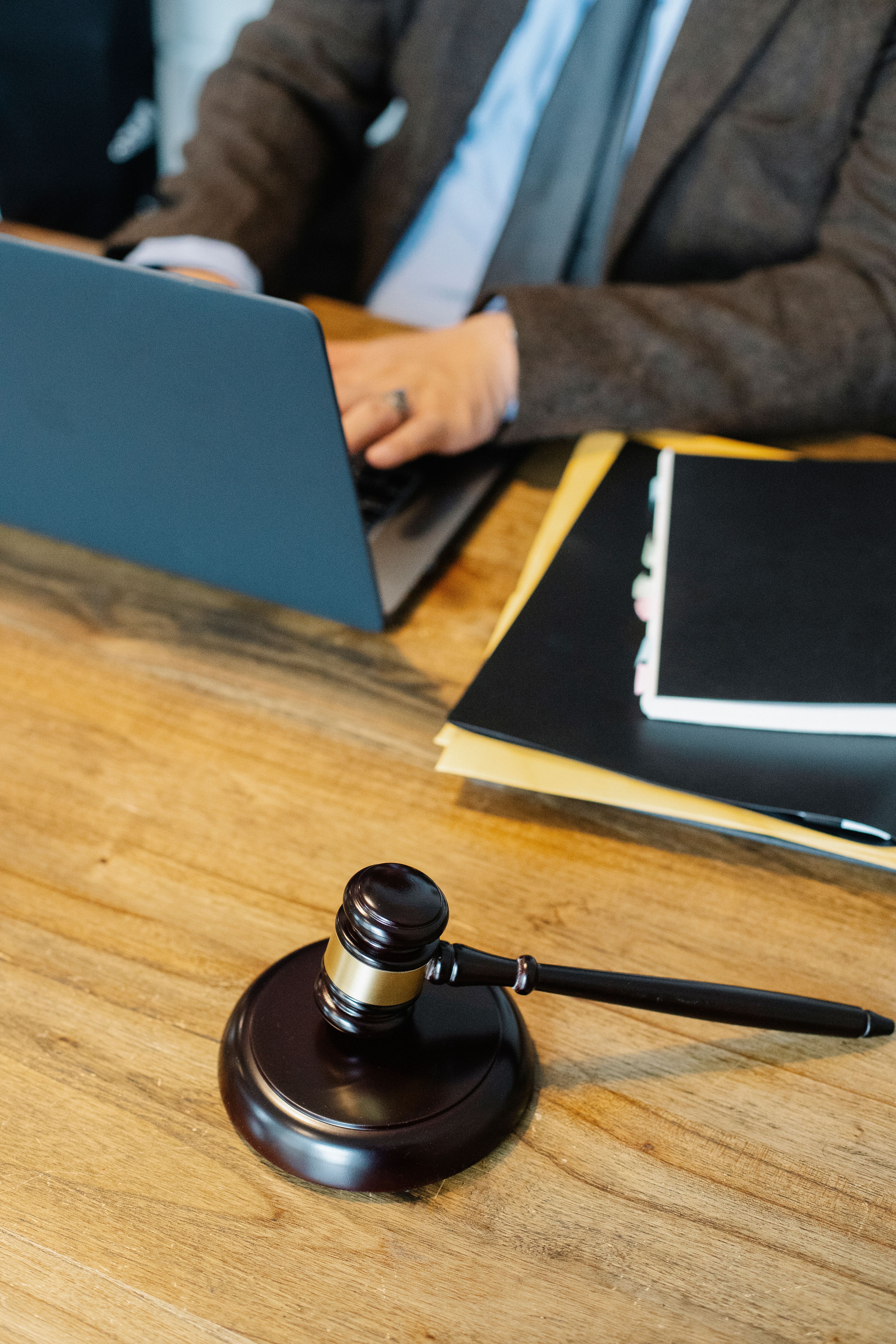 Wooden gavel representing serious legal issues in an acquisition
