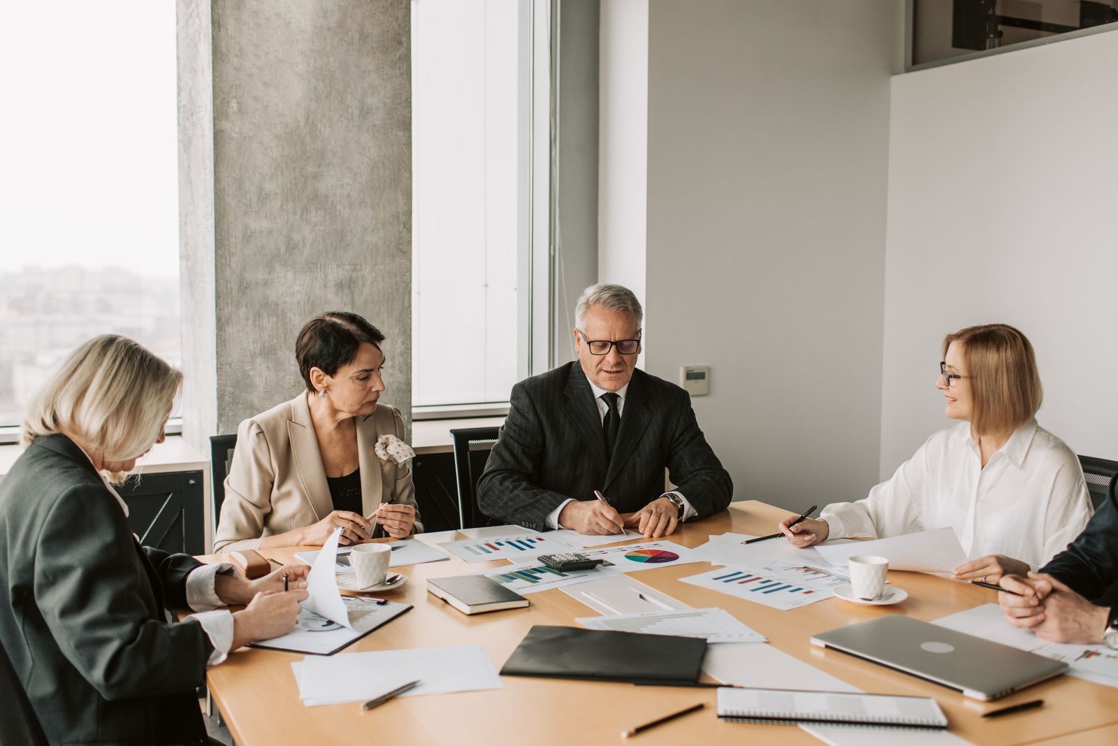 Board meeting discussing Tag-Along Rights protections for minority shareholders in M&A