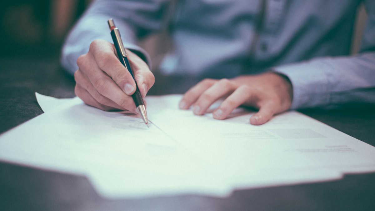 audited financial statements – investor reviewing and signing documents